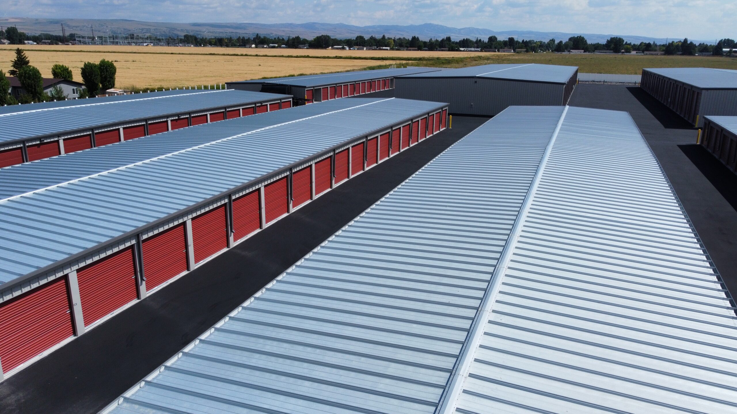 Drone view of storage facility asphalt maintenance and snow removal by JC Property Maintenance on the Wasatch Front